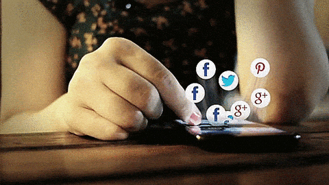Gif of a woman's finger scrolling on her phone laid flat, face-up on a table with logos coming out of it like bubbles