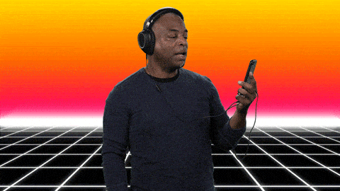 LaVar Burton on an early computer graphics check background with headphones on turning to the camera and saying 'amazing content'