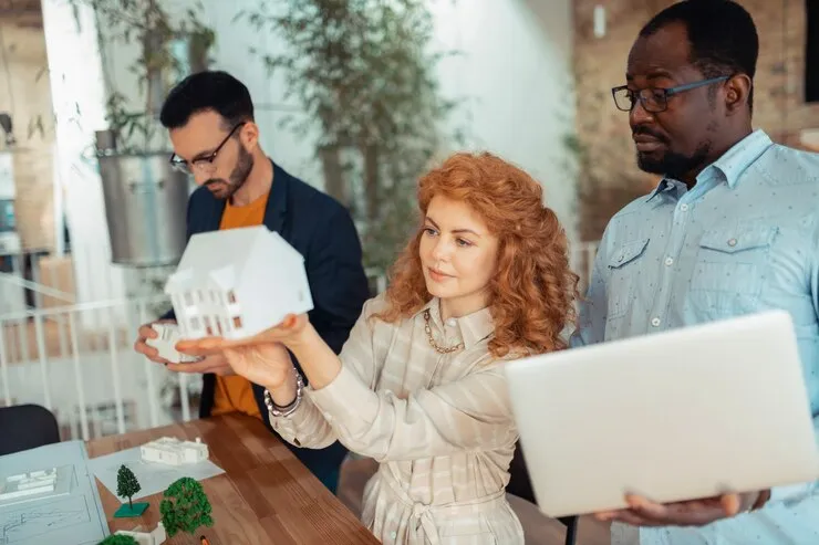 real estate professionals discussing model