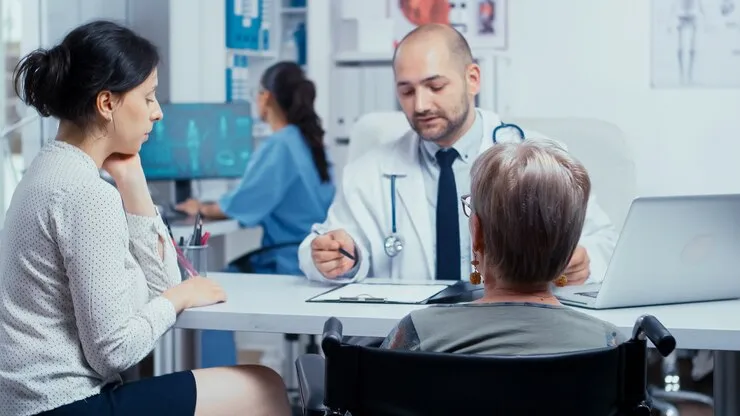 doctor consulting with patient and family