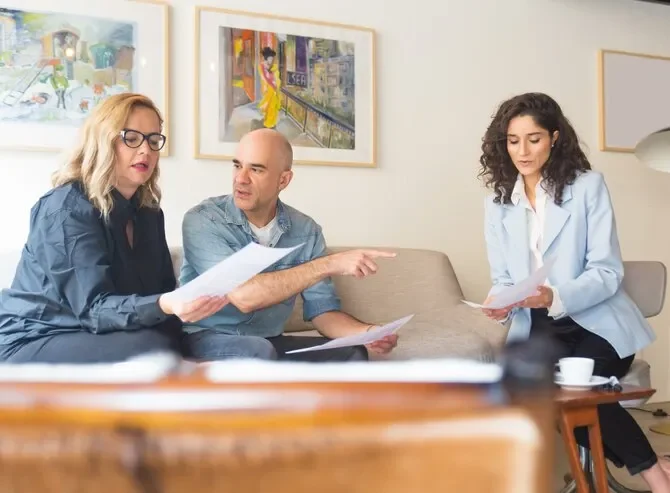 real estate professionals discussing documents