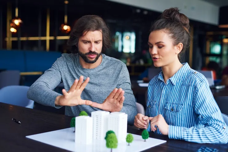 real estate professionals discussing model